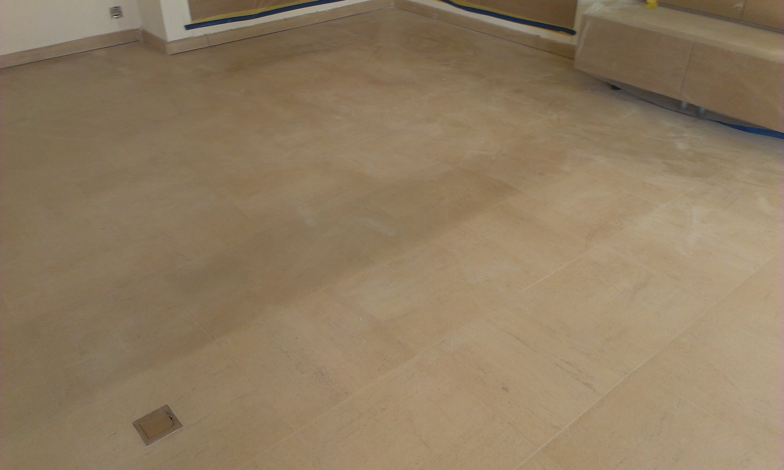 The natural stone floor after removing the carpeting and before cleaning and sealing